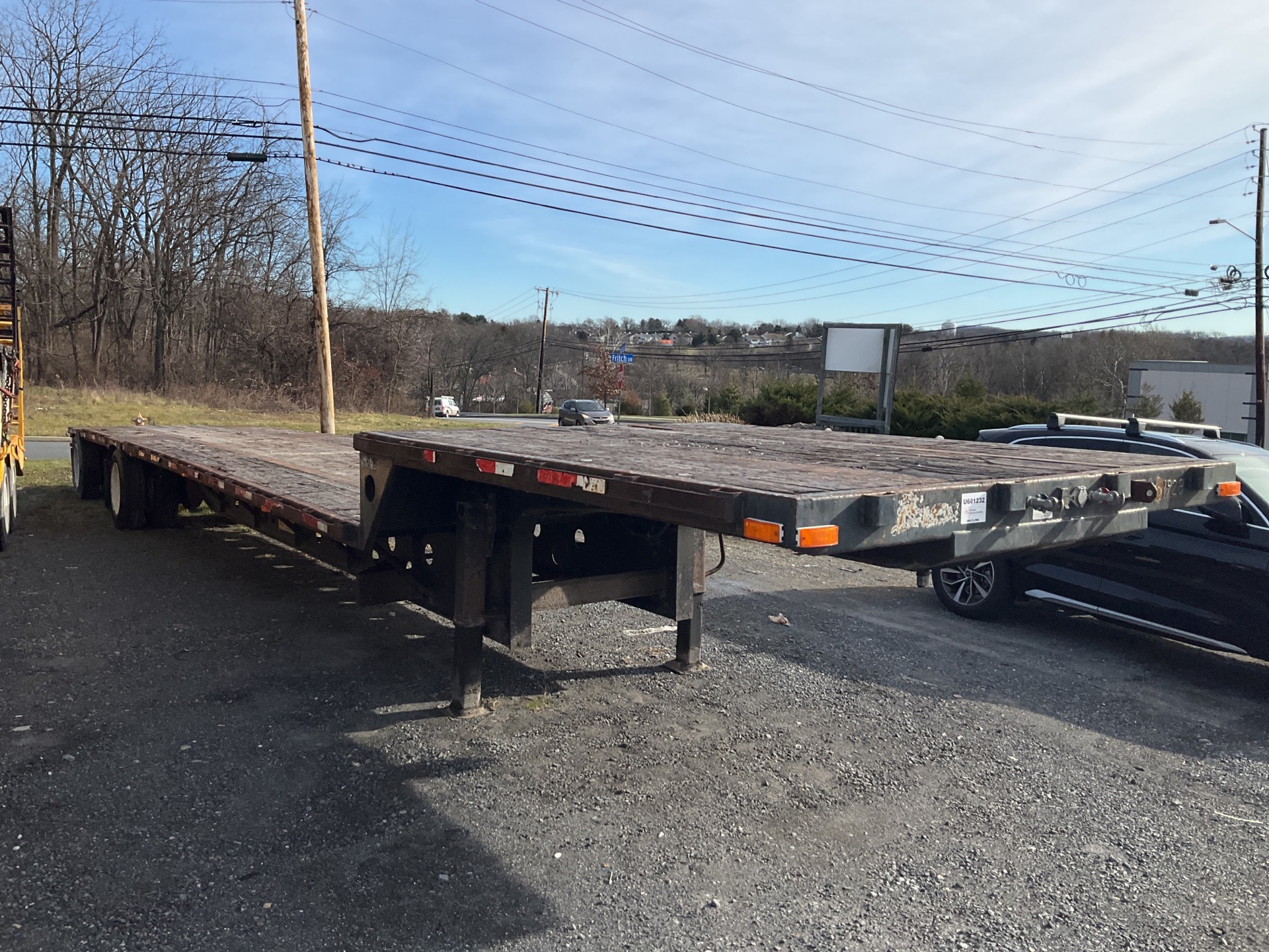 2010 Transcraft DTL-3000 W2 48 ft T/A Spread Axle Single Drop Step Deck Trailer