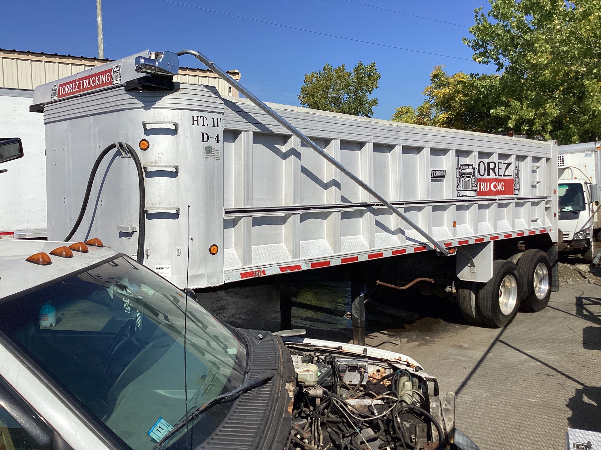 1999 Trail King  28 ft T/A Aluminum End Dump Trailer